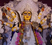 Left: Gourangini Mata in Rash jatra; Right: Chaitanya Mahaprabhu and Nityananda, is shown performing a 'kirtan' in the streets of Nabadwip, Bengal.