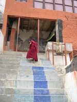 Left: Steps up to recent extensions to the monastery. (2004) Right: Maitreya Buddha in the hall