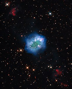 The interaction of two doomed stars has created this spectacular ring adorned with bright clumps of gas — a diamond necklace of cosmic proportions.[7]