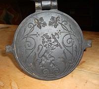 19th century krumkake iron decorated with national coat of arms