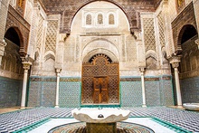 Interior facade of Al-Attarine Madrasa, showing ornate decoration