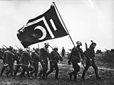 Soldiers carrying a religious flag during Balkan Wars, 1912[9]
