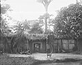 An Igbo compound entrance, in or near Önïcha. Photographed by Herbert Wimberley, c. 1903-18. Cambridge University