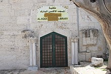 Sign above the al-Aqsa Library, with the Arabic words "women’s mosque" and the English word "mosque" painted over.