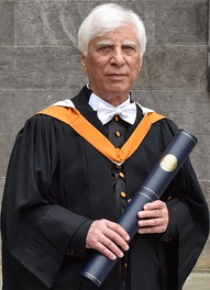 Bahram Beyzai, dressed in a traditional St. Andrews black cassock, having just received a D.Litt. honoris causa, June 2017