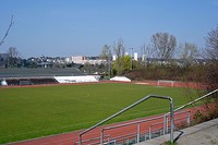 Association football pitch, surrounded by running track