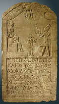 Left: A limestone stele dedicated by a Greek man named Onnophris depicting a male pharaoh, but honouring a queen Cleopatra (probably Cleopatra VII), located in the Louvre, Paris[note 28]Right: The cartouches of Cleopatra and Caesarion on a limestone stele of the High Priest of Ptah Pasherienptah III in Egypt, dated to the Ptolemaic period, and located in the Petrie Museum of Egyptian Archaeology, London