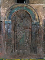 One of the seven life-size saints carved into the wall of the Church of Bet Golgotha, Lalibela, 15th century (traditionally believed to have been made during the reign of Gebre Mesqel Lalibela)[123]