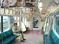 Interior view of SaHa E231-4600 car, showing E233 series derived interior, April 2010