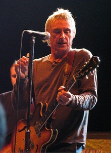 Weller playing guitar