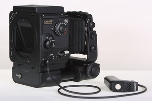 Most of the camera controls and a flash synchro socket are on the right side of the body, shown here with a 1m remote release. This is a bare body with bellows only; the revolving film holder would lock on to the prominent circular interface.