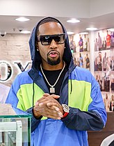 Rappers Safaree (left, pictured in 2019) and Plies (right, pictured in 2007) released remixes of "WAP". Safaree's remix was panned,[136] while Plies' was positively received.[137]