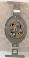 The back of a US four-pronged telephone jack (1964)