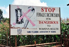 Roadside billboard saying "Stop female circumcision. It's dangerous to Women's health. Family Planning Association of Uganda." Displaying a crossed out razorblade and knife on the left.