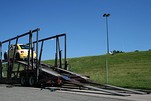 Using ramps to load a car on a truck