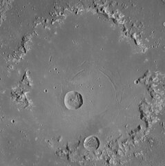 Central peak ring. Concentric troughs are visible.