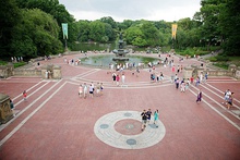 Bethesda Terrace and Fountain with people walking on the Central Park Mall