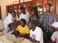 Universidade Lusófona of Bissau (up). Students at Biblioteca Jovem, Bairro da Ajuda, in Guinea-Bissau. (down)
