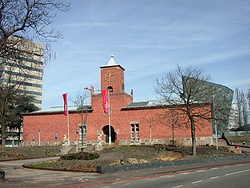 Red brick building with a central tower