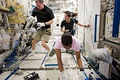 The crew sorting out blueprints in the Japanese Experiment Module