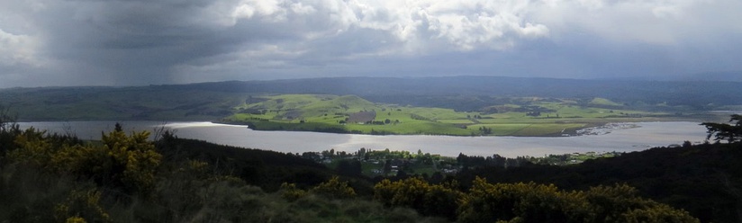  Panorama of Lake Waihola, seen from the hills to the southeast. Part of the settlement of Waihola is visible in the centre of the image.