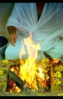 A Yajna Vedi (square altar) with Samagri (offerings) on left, and a Yajna in progress (right).