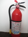 A typical dry chemical extinguisher containing 5 lb (2.3 kg) of monoammonium phosphate dry chemical