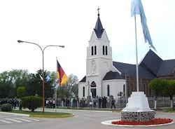Flags of Argentina, Buenos Aires Province and Germany in front of St. Joseph Catholic Church in San José, Coronel Suárez Partido, Argentina