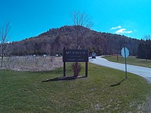 The entrance of Mount Philo State Park with the mountain in the background.
