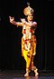 The Krishna legends in the Bhagavata Purana have inspired many performance arts repertoire, such as Kathak, Kuchipudi (left), Odissi and Krishnanattam (right).[24][26] The Rasa Lila where Krishna plays with the gopis in Manipuri dance style (center)