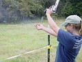 The recoil from the .500 S&W Magnum cartridge inducing significant muzzle rise during firing a Smith & Wesson Model 500 revolver.