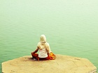 Dhyana along river Ganges in Varanasi (left), Om in Tamil script as an instrument for meditation (right).