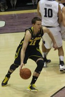 Stauskas in action in the 2012–13 Big Ten Conference men's basketball season opener on January 3 against Northwestern: left—slashing, left center—a layup, right center—follow through on a three-point field goal, right— a jump shot