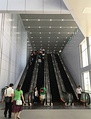 Escalators just after the pedestrian link entrance at the KLIA Ekspres arrival hall