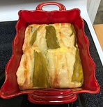 A Mexican-American variation which has chiles stuffed with monterey jack cheese and an egg batter, baked in a casserole dish