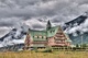 Exterior view of the Prince of Wales Hotel with the Canadian Rockies in the background