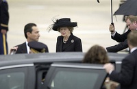 Thatcher exiting a limousine on the ramp at Andrews Air Force Base