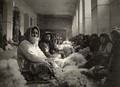 Armenian refugees from Turkey carding wool in Tiflis, Georgia. Photograph by Melville Chater from the National Geographic Magazine, 1920.