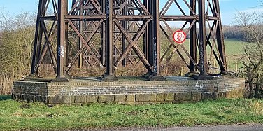 The bottom of a pier, showing the concrete and brick base