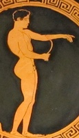An Ancient Greek athlete using a strigil, which is a device used for cleaning off oil and dirt