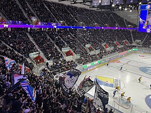 Sold-out, double-decker back straight during a game between the ZSC Lions and SC Bern (2022)