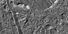 Left: surface features indicative of tidal flexing: lineae, lenticulae and the Conamara Chaos region (close-up, right) where craggy, 250 m high peaks and smooth plates are jumbled together