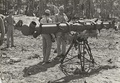 Stereoscopic rangefinder (Bausch & Lomb M1) being used by the United States Marine Corps's 2d Airdrome Battalion on Nukufetau on November 27, 1943.