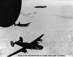 Consolidated B-24 Liberators of the 392d Bomb Group on a mission over enemy-occupied territory