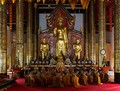 Monks chanting inside the viharn