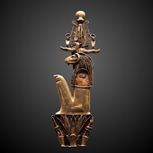 Amulet in the form of Heryshaf seated on a lotus; 1069–332 BC; gold; height: 11.5 cm, width: 3.4 cm; Louvre