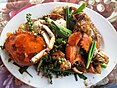 Cambodian stir-fry dishes: Beef lok lak; cha kroeung; chha kh'nhei; Kampot Pepper Crab (clockwise from top left)