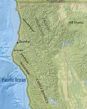 The unofficial Calisota map shown on the left indicates the location of Duckburg. The map resembles a map of Northern California (right), with Duckburg corresponding to a coastal area in Humboldt County near the city of Eureka, located on Humboldt Bay, California.[12]