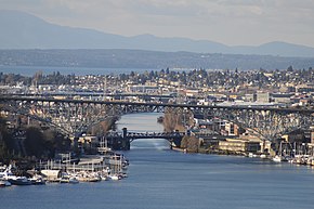 The Fremont Cut of the Lake Washington Ship Canal, seen from the grounds of the St. Mark's Episcopal Cathedral complex, across Lake Union
