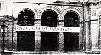 The local synagogue was destroyed during the German occupation. The inscription reads in German: "This city is free of Jews".